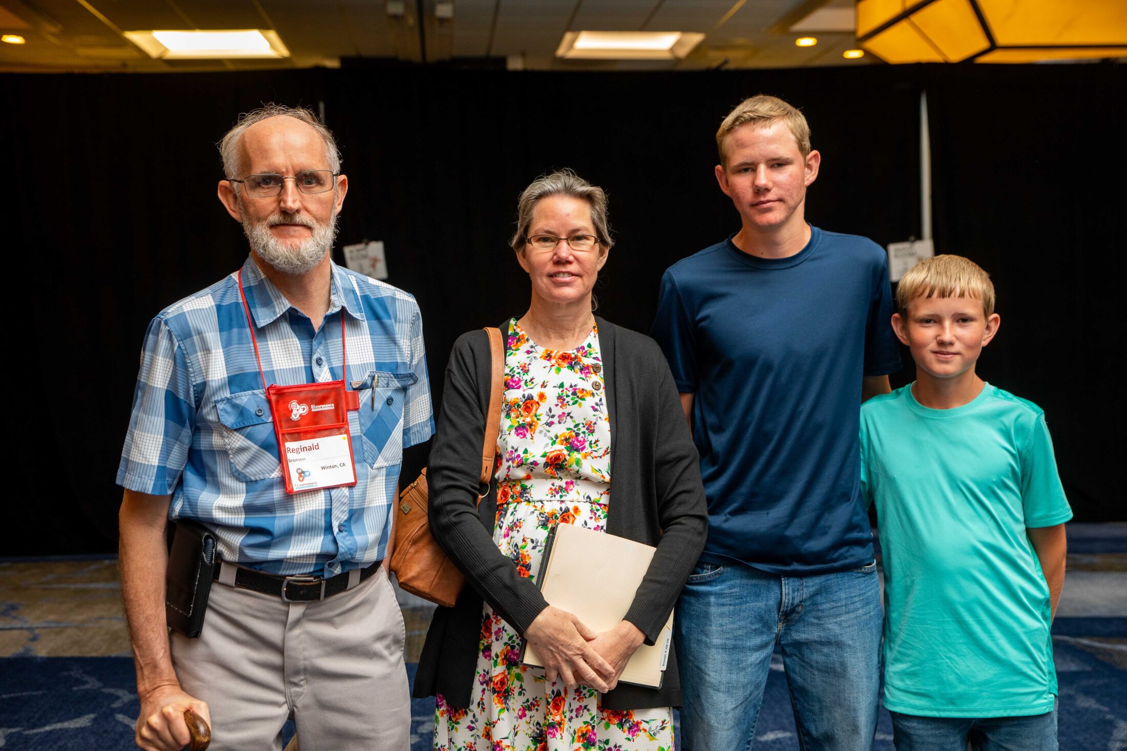 Reg attending Conference with his wife, Edith, and their two sons.