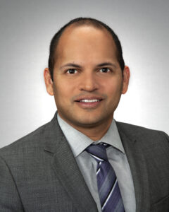 Headshot of Dr. Arvin Hoskoppal in suit and tie. 
