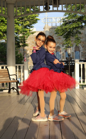 The Damaa sisters pose in red tutus