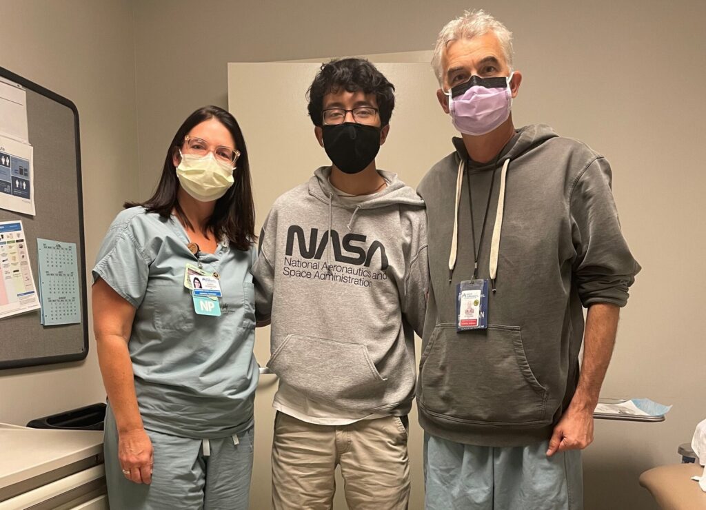 Jesus, Aida's son is pictured with a PA and his surgeon 