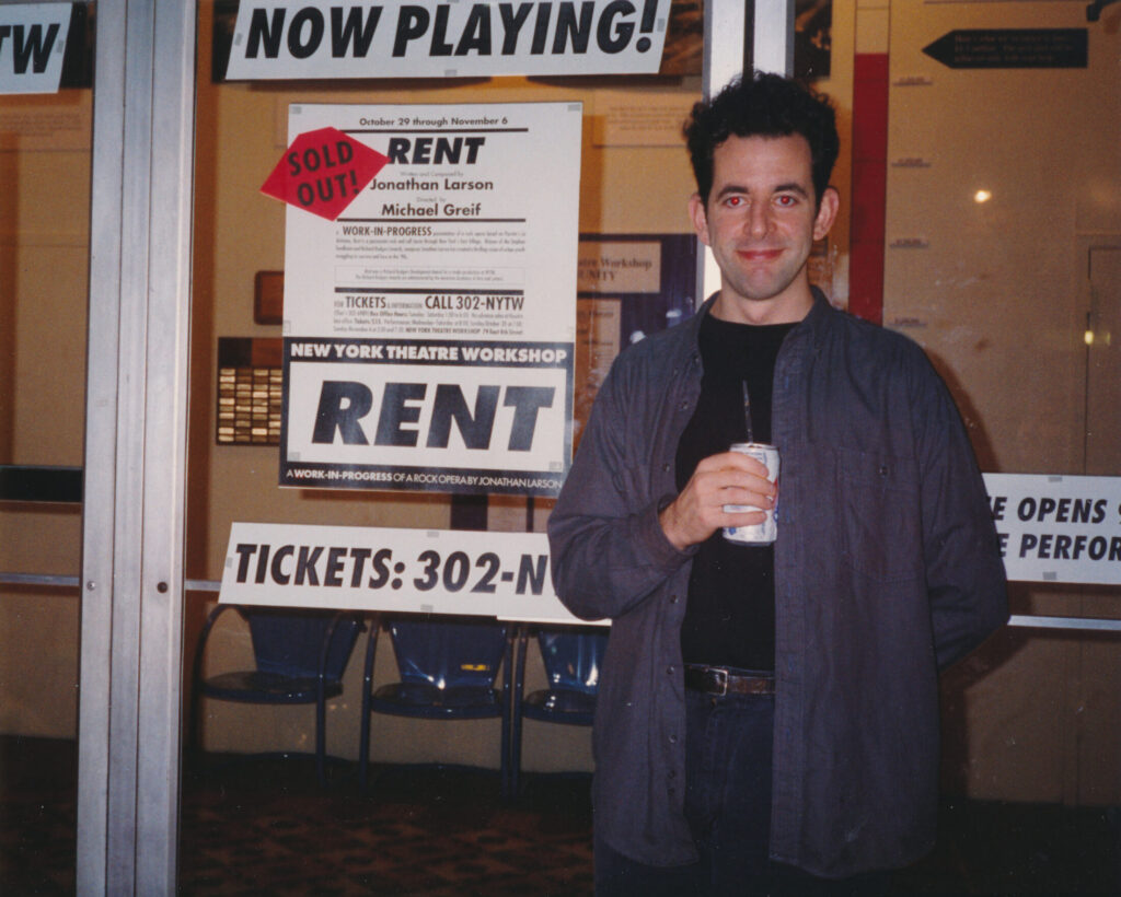 Jonathan Larson pictured by the opening bill for Rent just prior to his passing