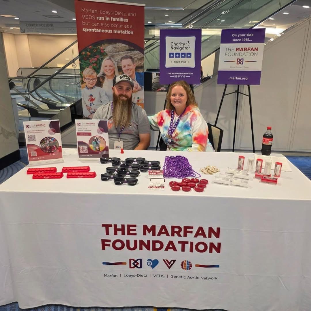 Justens at Conference Marfan Foundation table