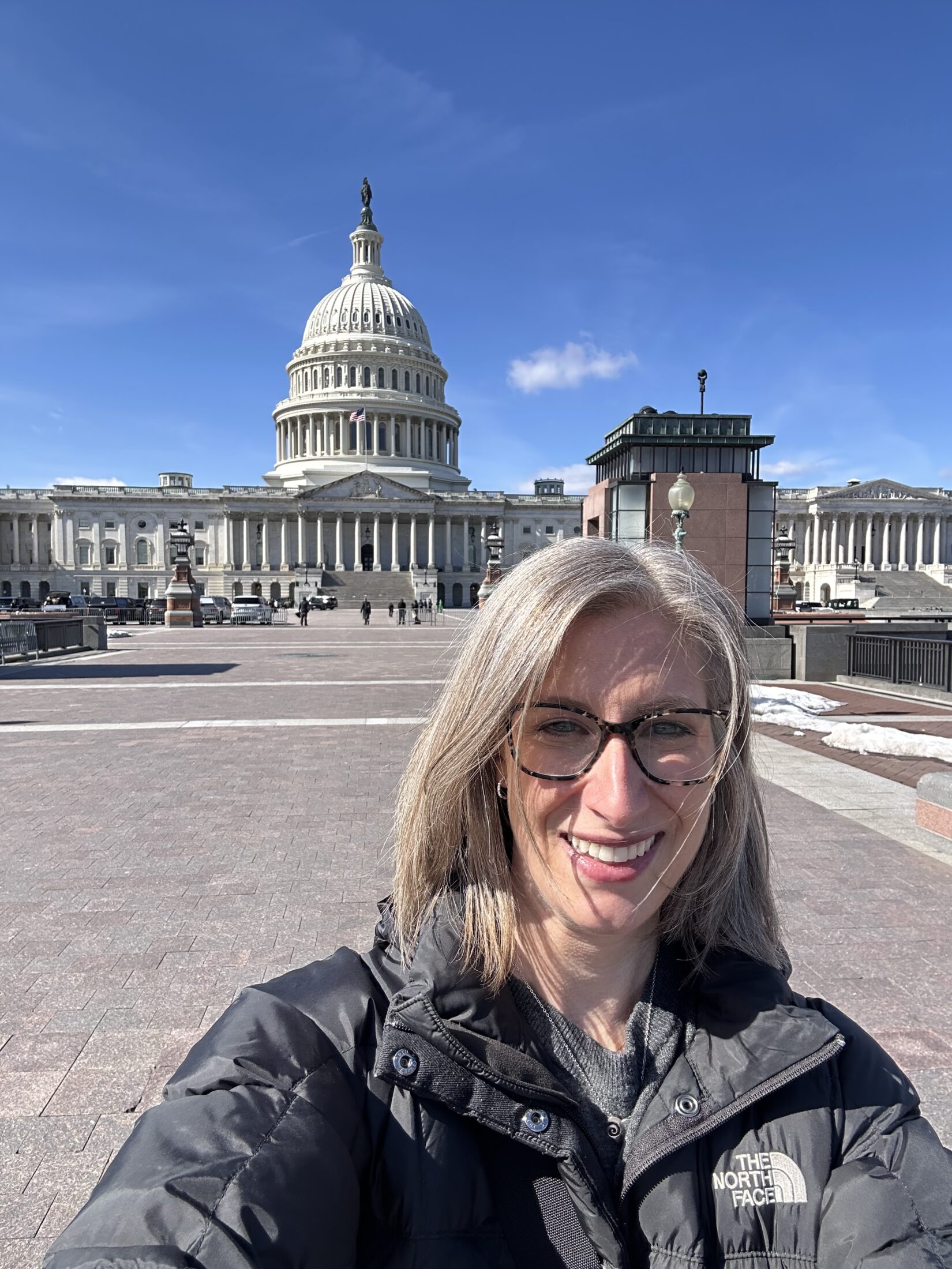 Stacey Watson is depicted in front of the US Capitol during Rare Disease Day 2026 Advocacy through NORD, representing the Marfan Foundation