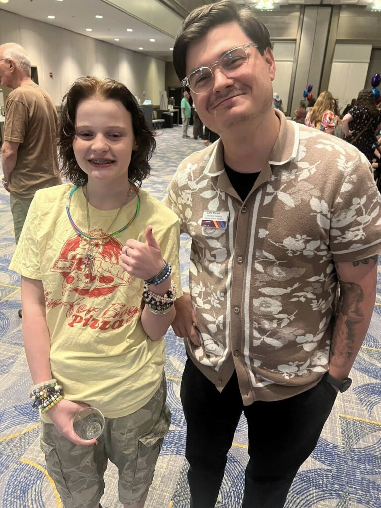 Development Manager Chris Theriot with a young member of the LDS community at the Marfan Foundation Conference. 