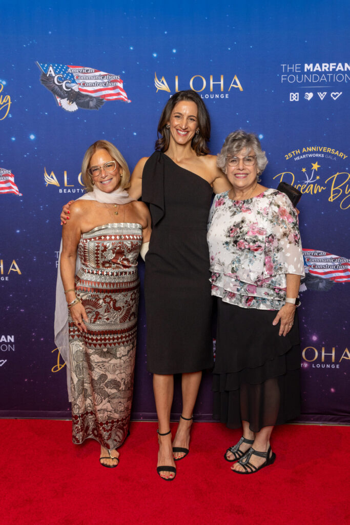 At the NYC HeartWorks Gala 2025, Judy Gibaldi and Helaine Baruch with a long-time volunteer. 