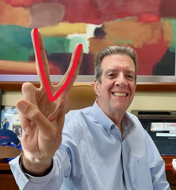 Bert Medina smiling with his fingers in a V supporting the VEDS Movement and the V Matters campaign. 