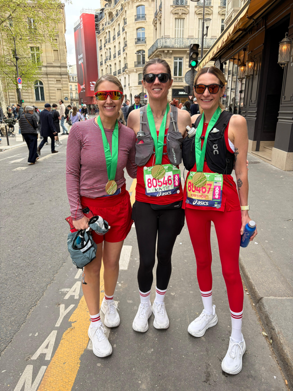 Runners from the Marfan Foundation's Team Victory pose in the streets of Paris at the 2026 Paris Marathon.