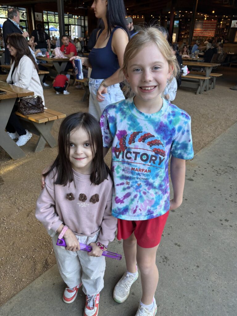 Sofia Maria and friend at Houston VEDS Party 2026. Two girls pictured smiling at an event. 