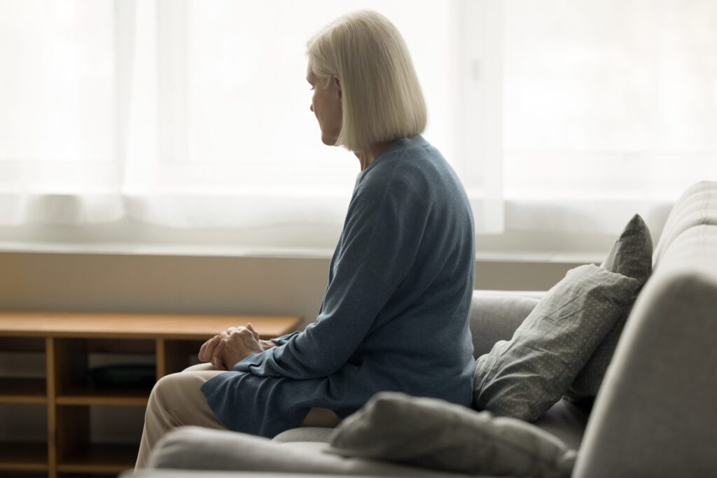 A woman is pictured amid grief. 