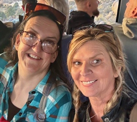Jennie Aucoin and New Friend Danielle Pose Dressed Casually and Smiling. Both live with Marfan Syndrome and met at the Marfan Foundation 2025 Conference.