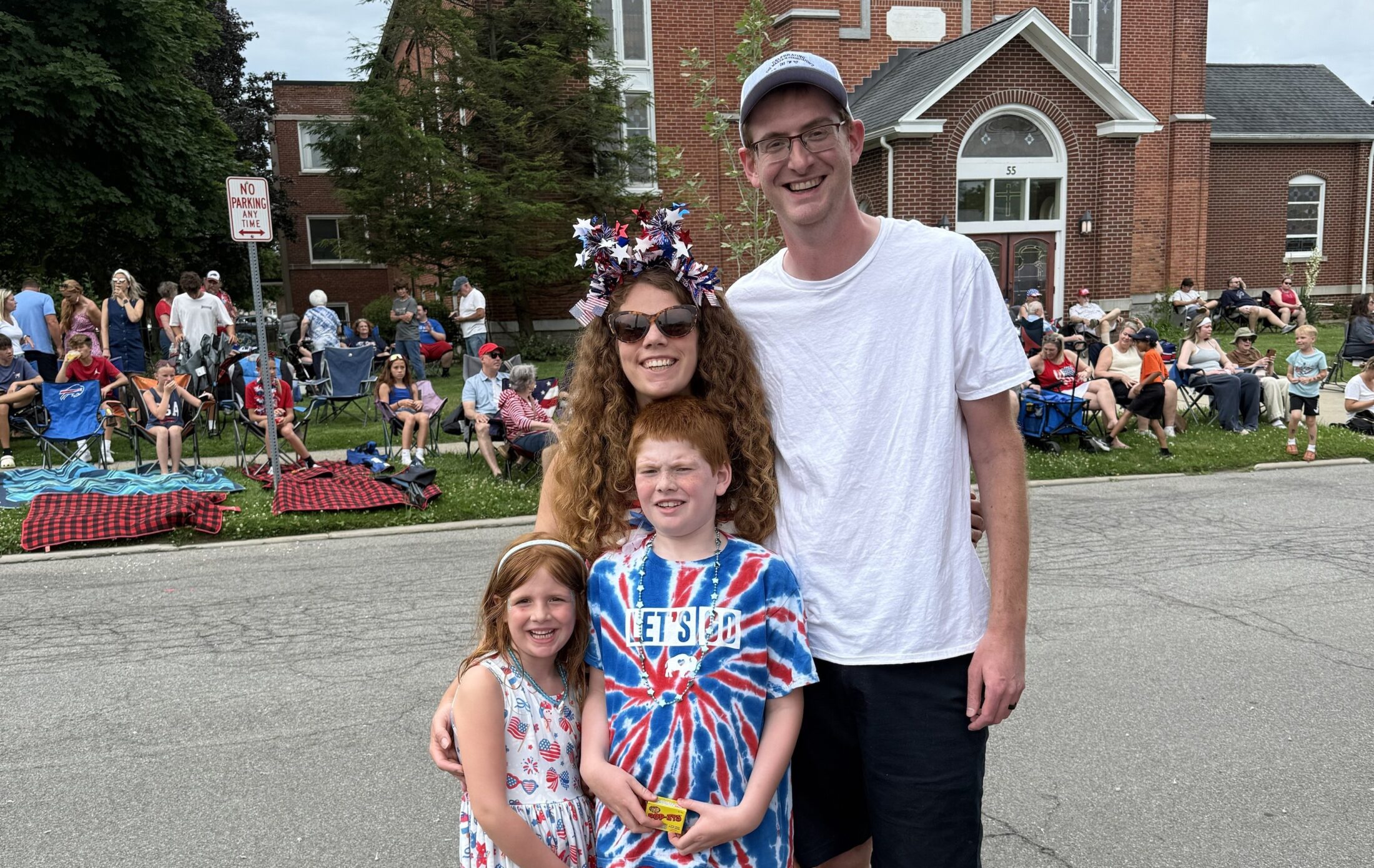 Stephanie Amdur-Clark is pictured with her family in a group, smiling.