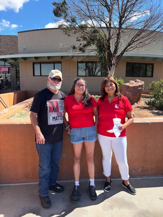 The Marin family poses in red VEDS shirts