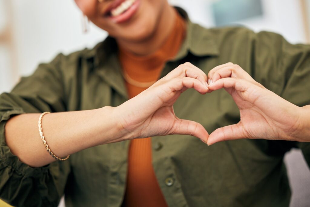 Woman making heart hands